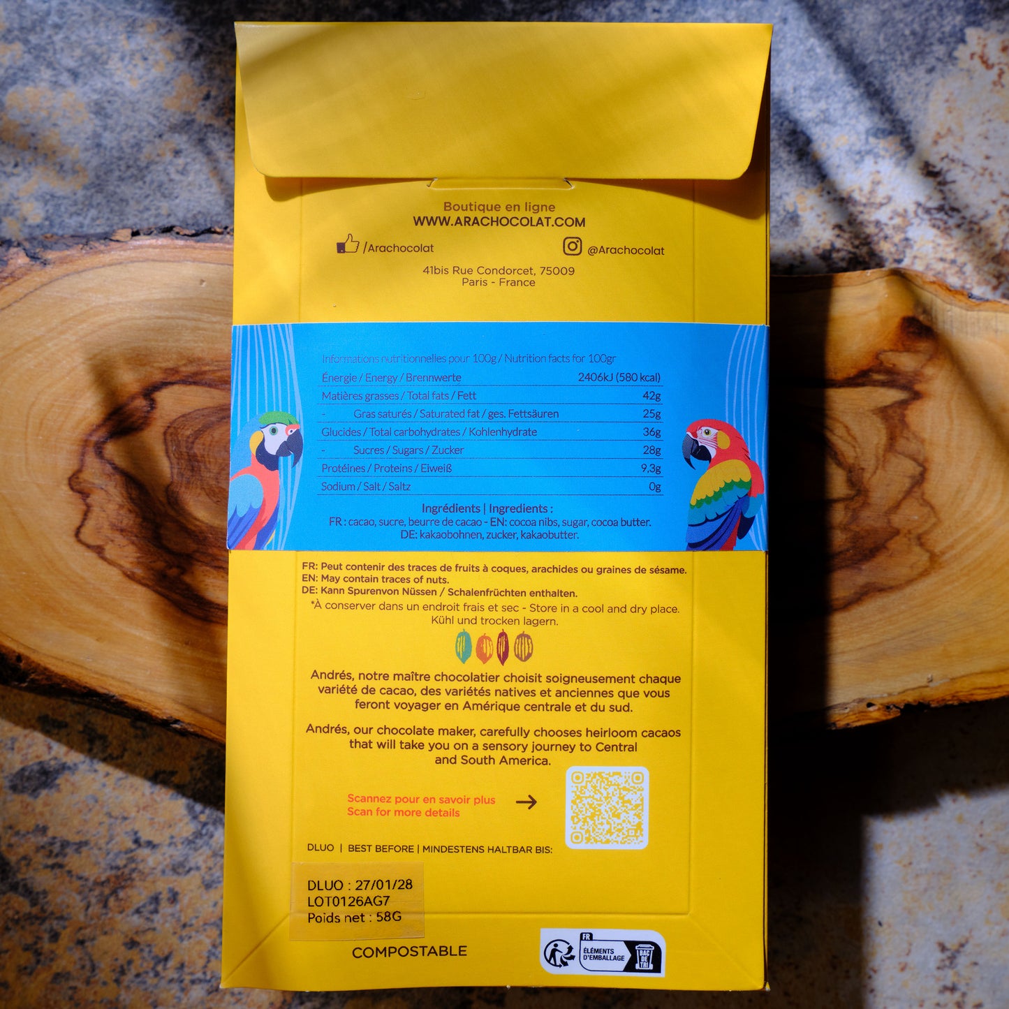 Ara Chocolat Gibraltar 70% Dark Chocolate Bar Back of a chocolate packaging with brand details on a wooden surface