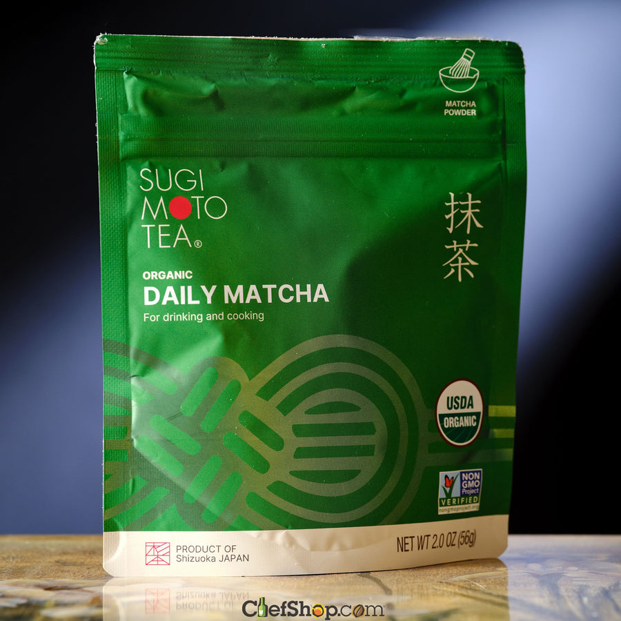 Green package of Sugi Moto Tea Organic Daily Matcha on a reflective surface with a gradient background.