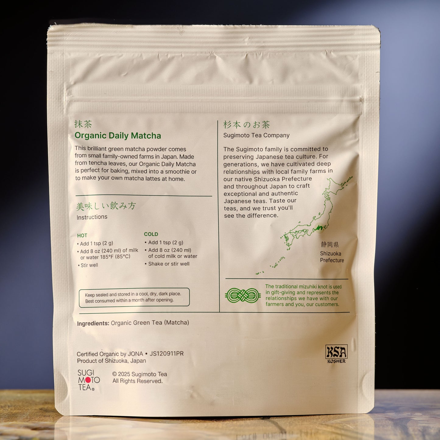 Package of Organic Daily Matcha with text and branding on a reflective surface.