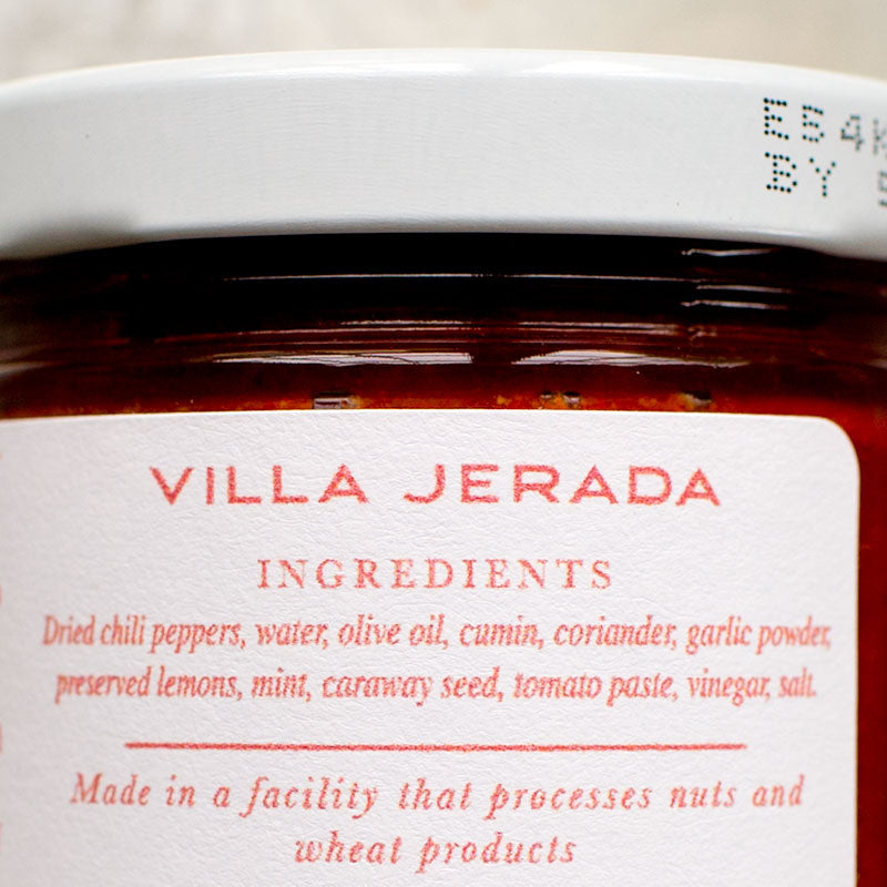 spreading harissa on roll