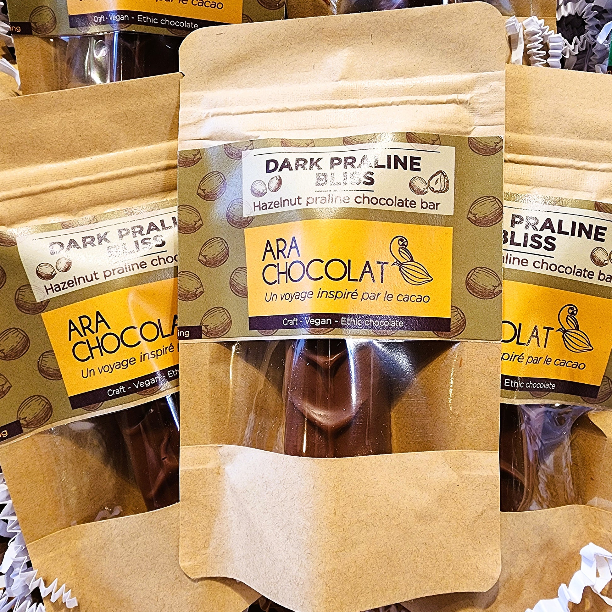 ARA CHOCOLAT Dark Praline Bliss chocolate bar packaging on a wooden surface Hazelnut