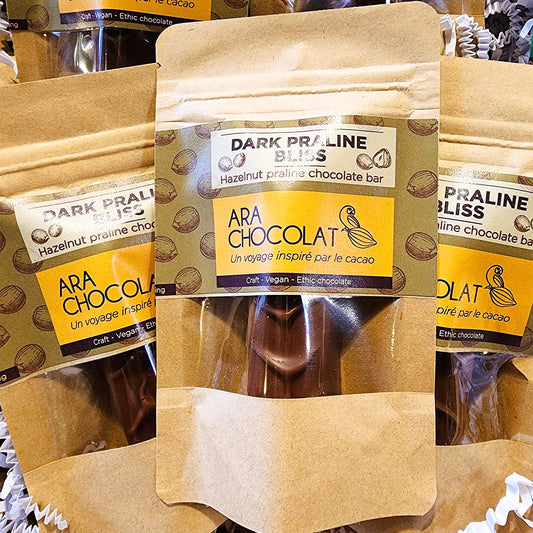ARA CHOCOLAT Dark Praline Bliss chocolate bar packaging on a wooden surface Hazelnut
