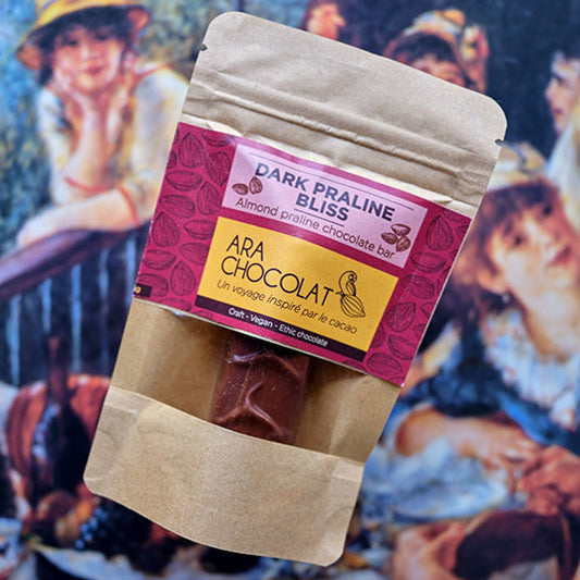 Packaged chocolate bar with 'ARA CHOCOLAT' label on a colorful background Almond Praline
