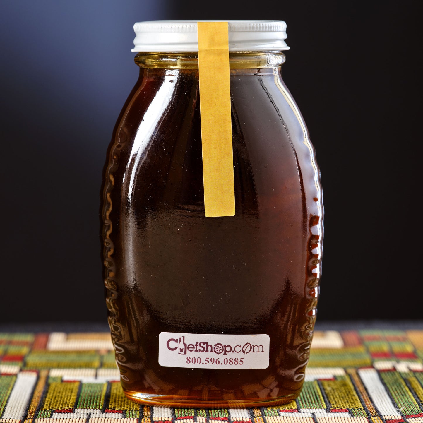 Jar of Honey with a label on a colorful Frank Lloyd Wright  placemat