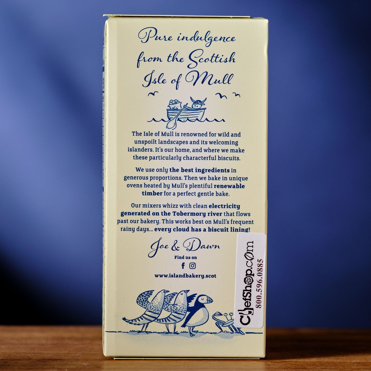 Box of biscuits with text and branding on a blue background Island Bakery Orange Melts Shortbread Cookie with Milk Chocolate