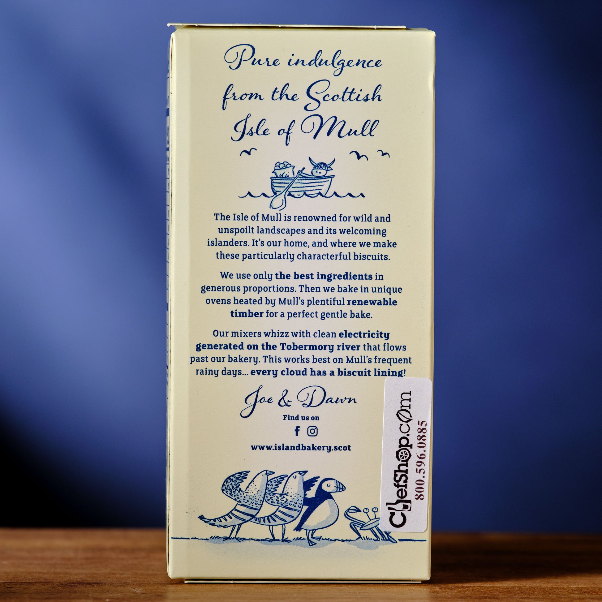 Box of biscuits with text and branding on a blue background Island Bakery Orange Melts Shortbread Cookie with Milk Chocolate