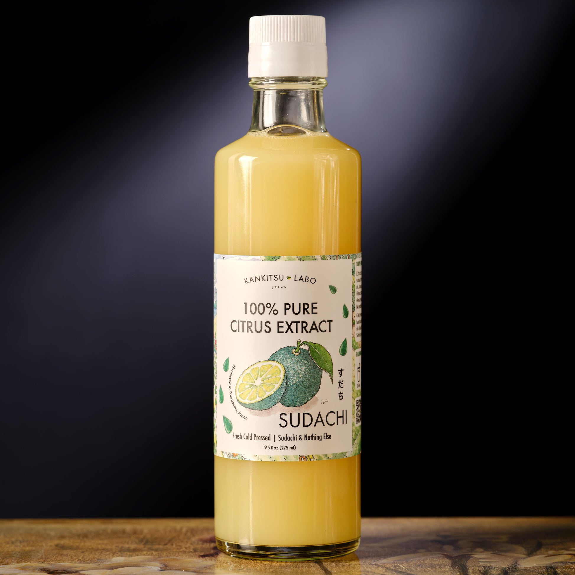 Labo 100% Pure Cold-Pressed Sudachi Extract Bottle of 100% Pure Citrus Extract with a label on a dark background