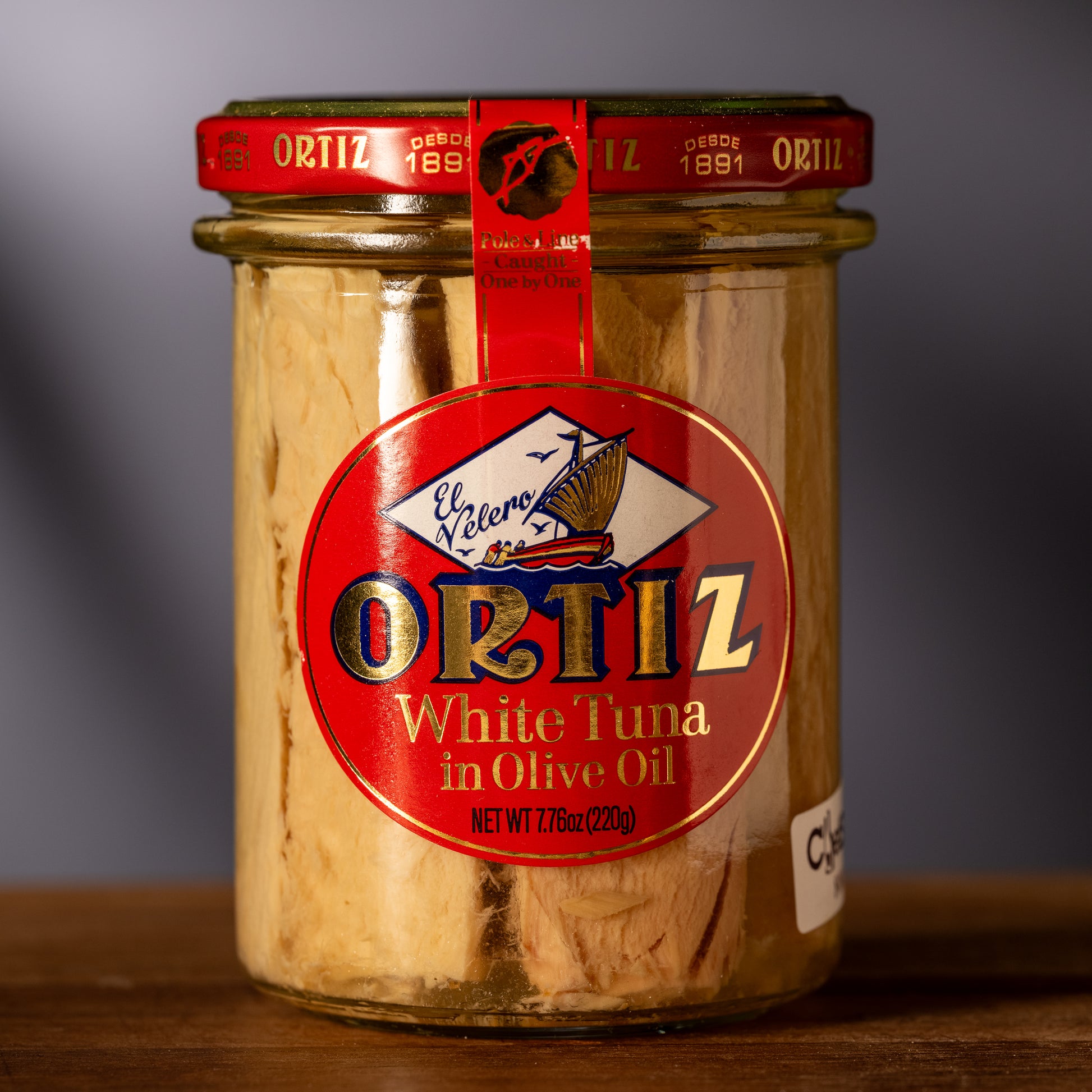 Glass jar of tuna in olive oil