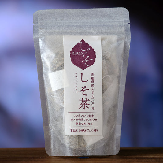 Shiso Tea - Japanese Perilla Tea bag package with a label on a blurred background