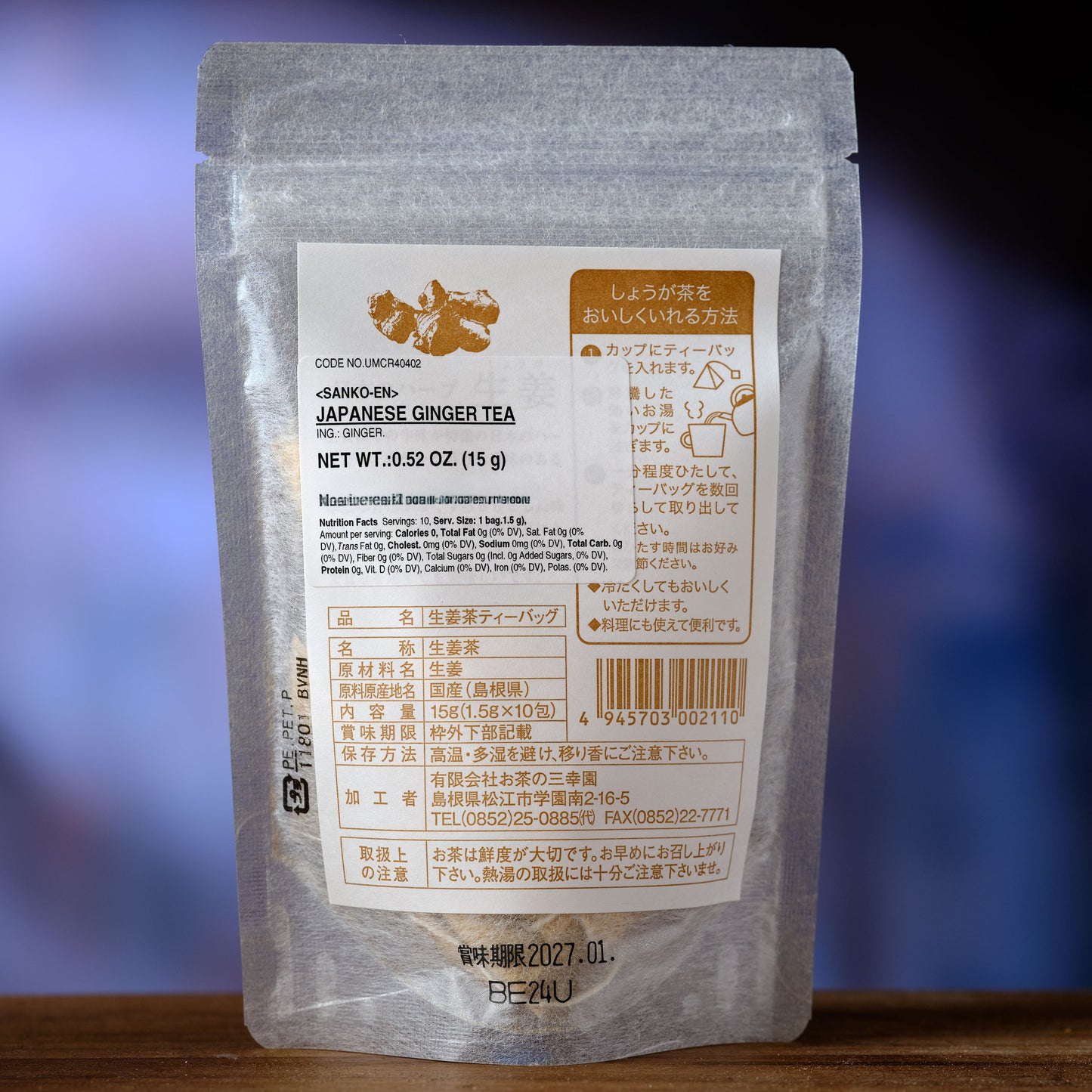 Japanese Ginger Tea  Packaged Japanese ginger tea with label on a wooden surface and blurred background