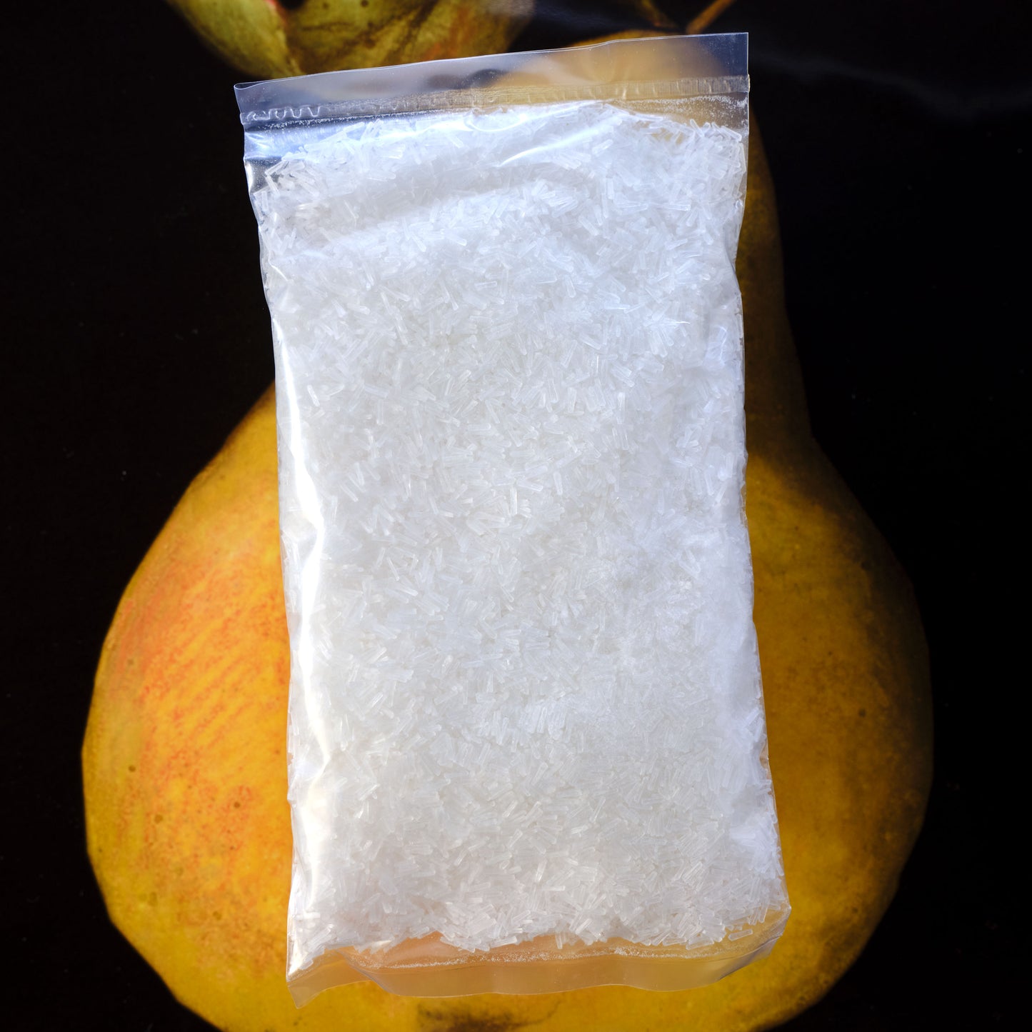 White granulated substance in a clear plastic bag on a dark background Ve Wong MSG - Monosodium L-glutamate
