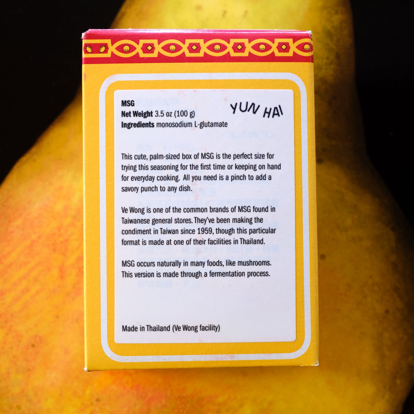 Yun Hau MSG seasoning packet on a wooden surface Ve Wong MSG - Monosodium L-glutamate